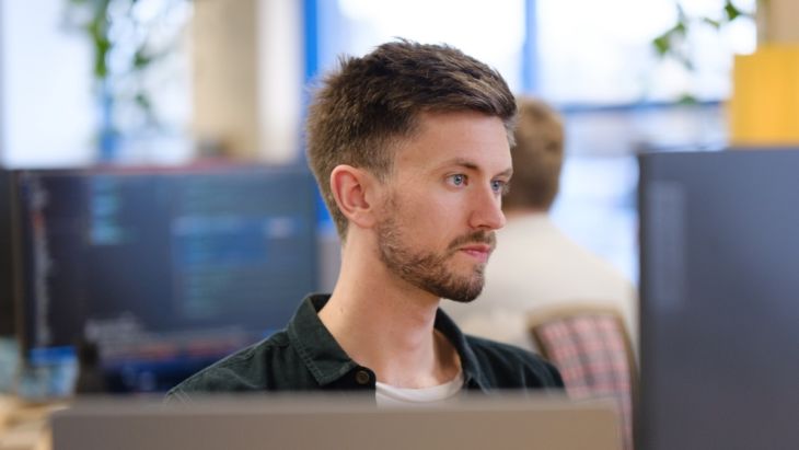 Jonny concentrating at his desk