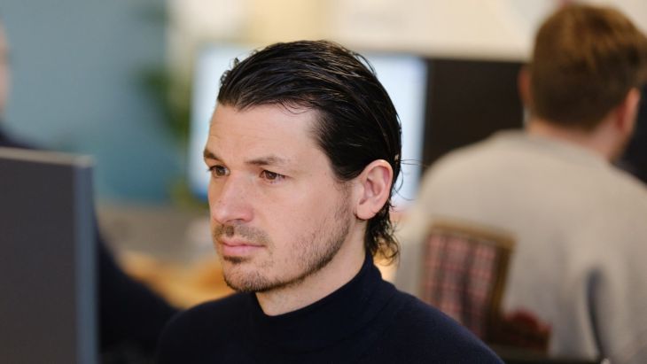 A photo of Simon writing a blog