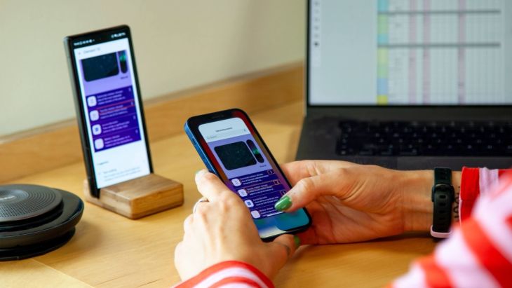 An image of someone holding a phone and using testing devices