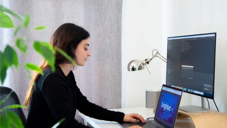 Ellie working at her desk